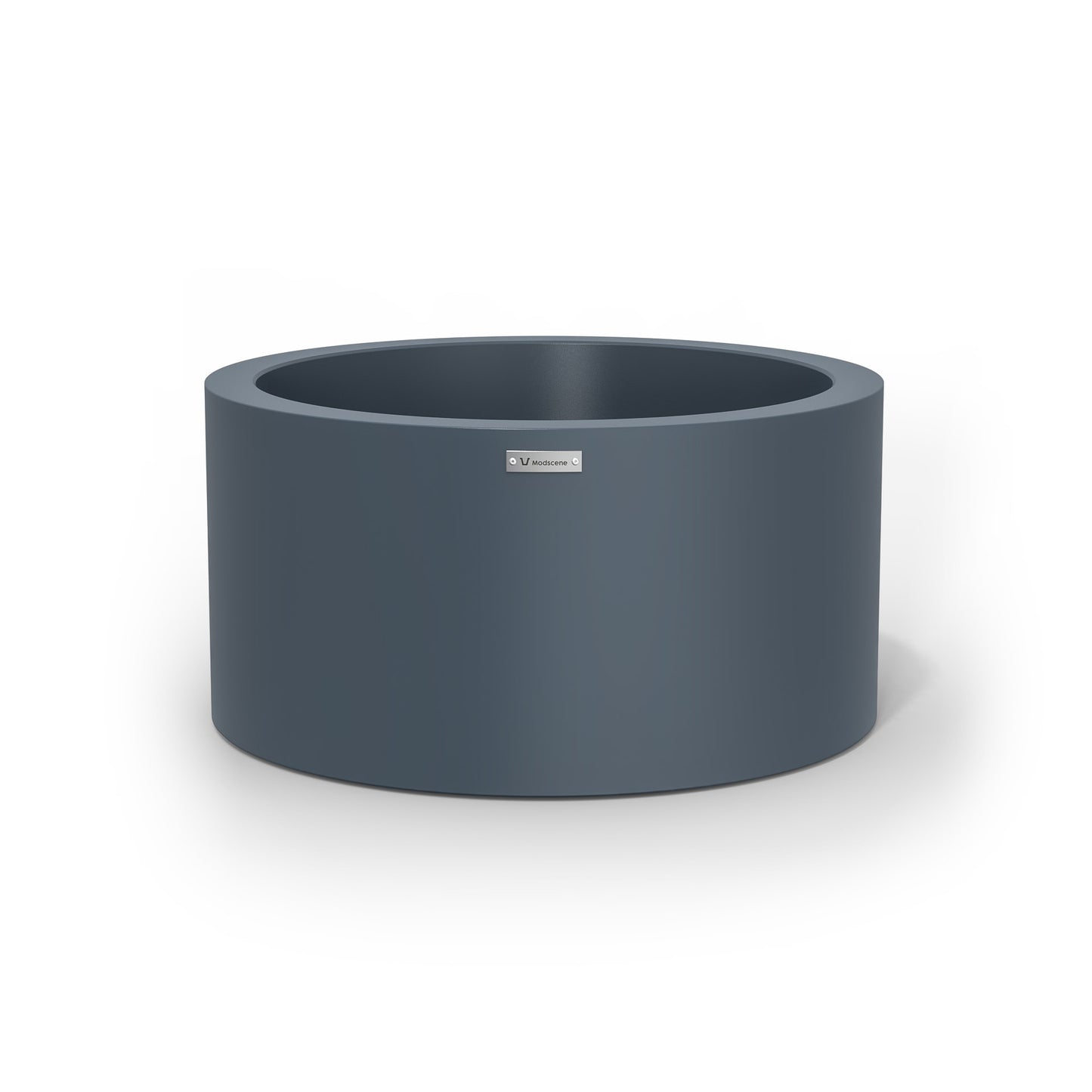A medium sized planter pot in a storm blue made by Modscene.