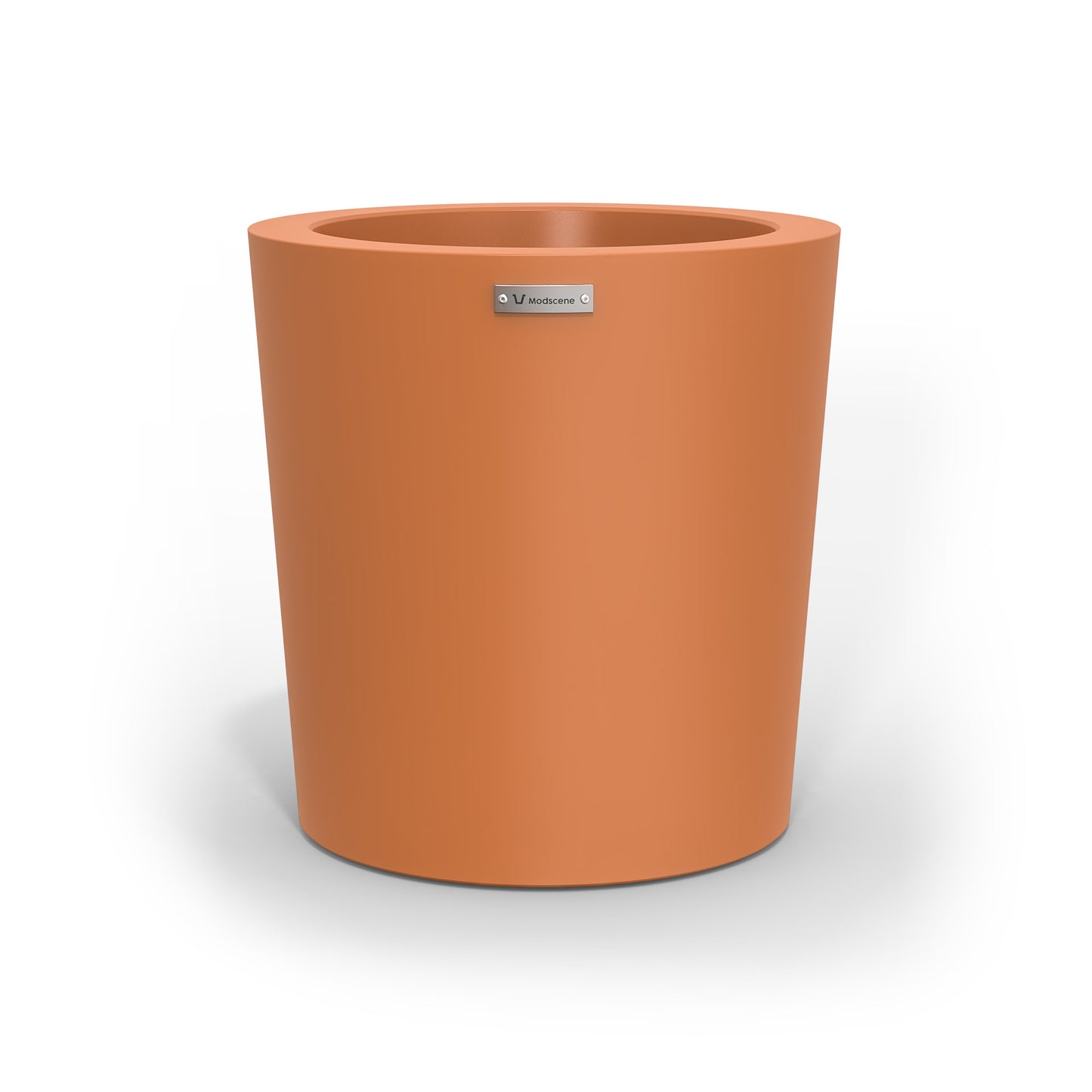 A modern designer planter pot in a smooth terracotta colour.