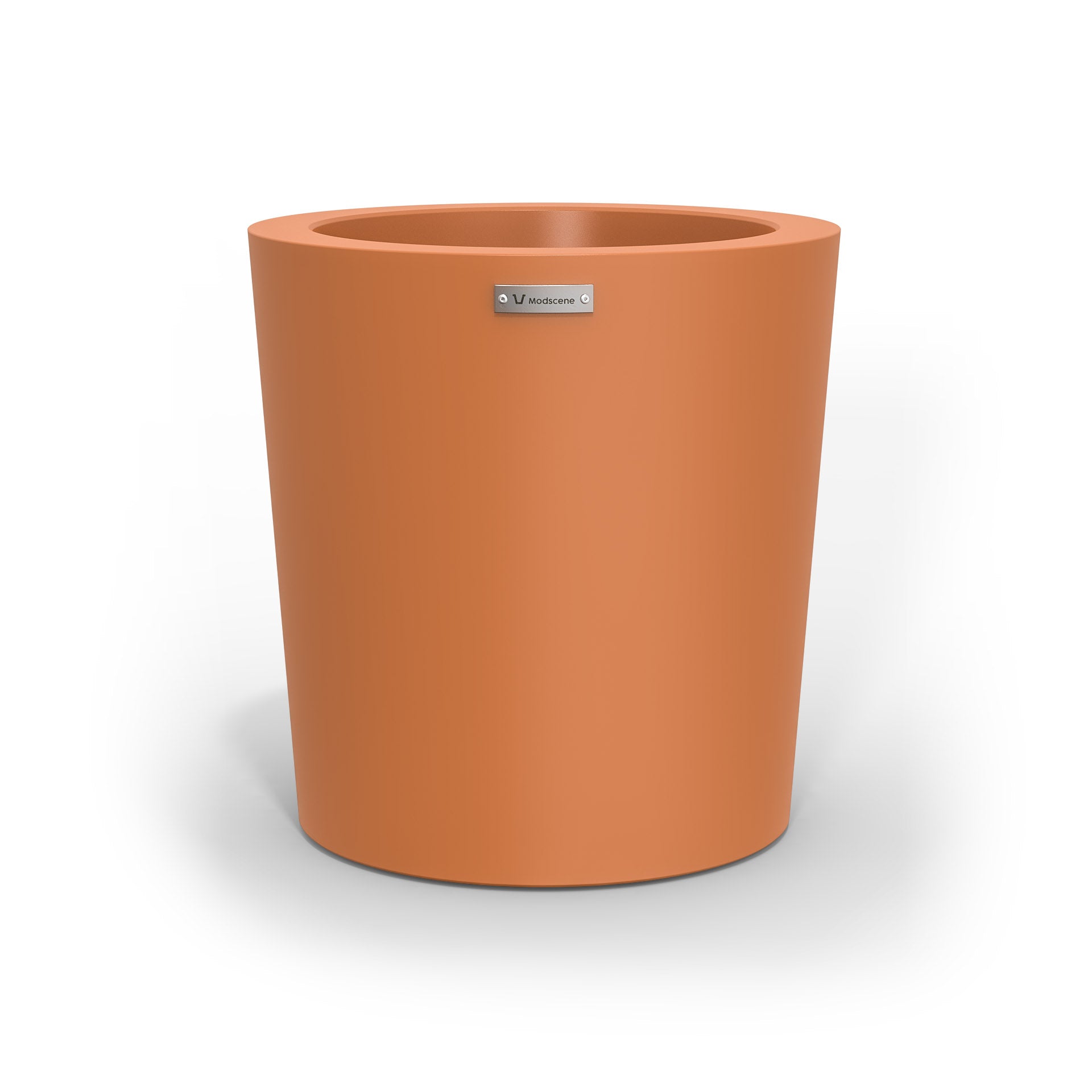 A modern designer planter pot in a smooth terracotta colour.