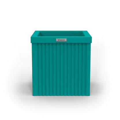 A small cube shaped planter pot in a teal blue colour made by Modscene.