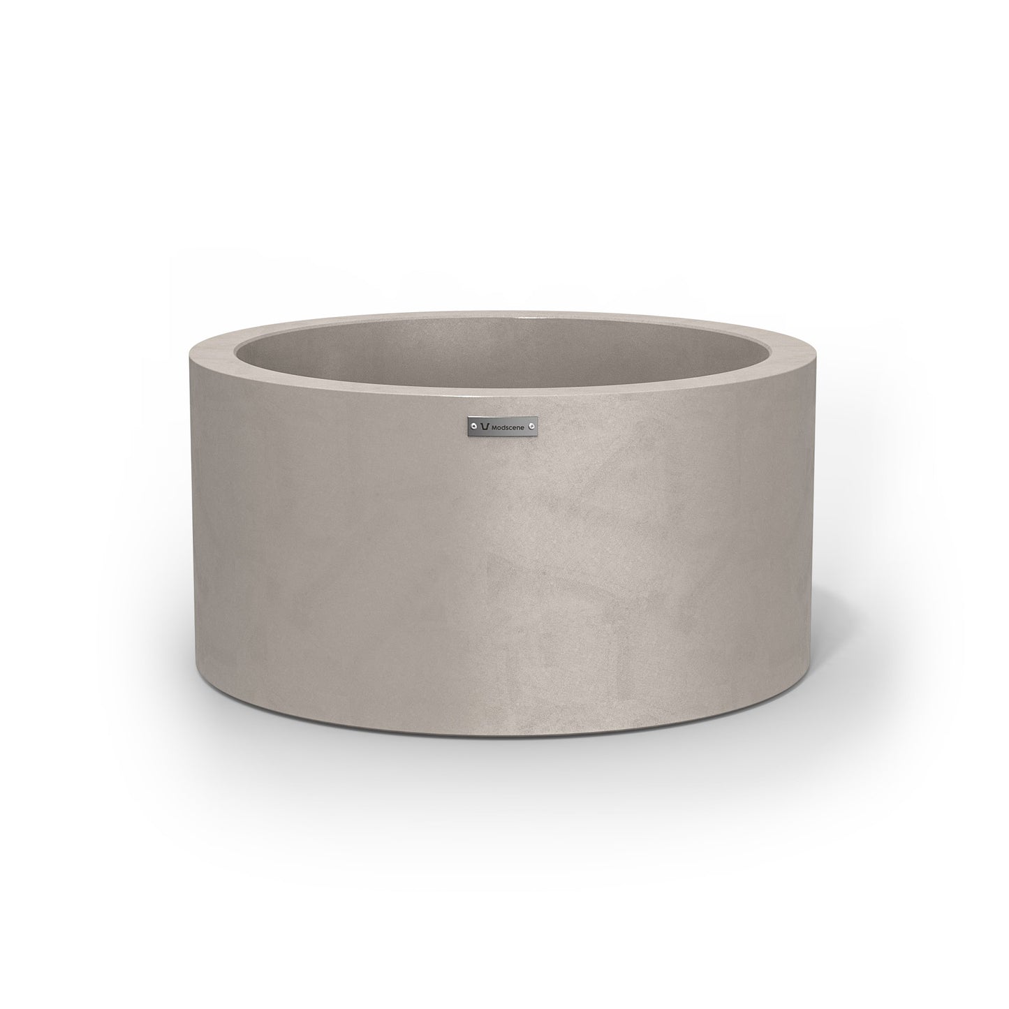 A cylinder pot planter in a sand stone colour with a concrete look finish.