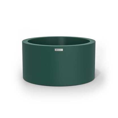 An emerald green cylinder pot planter made by Modscene.