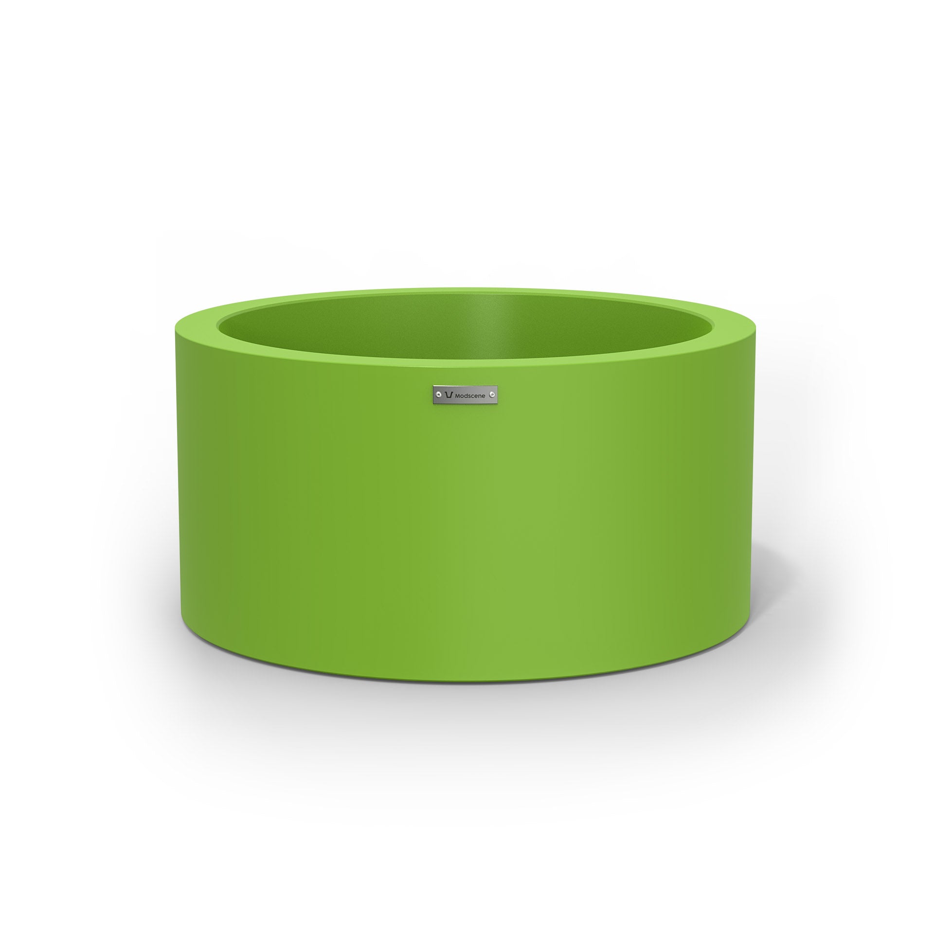 A green cylinder pot planter made by Modscene.