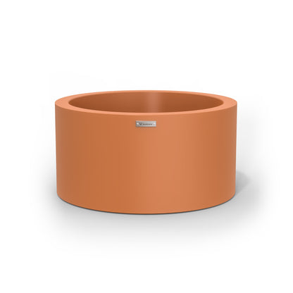 A medium sized planter pot in a terracotta colour made by Modscene.
