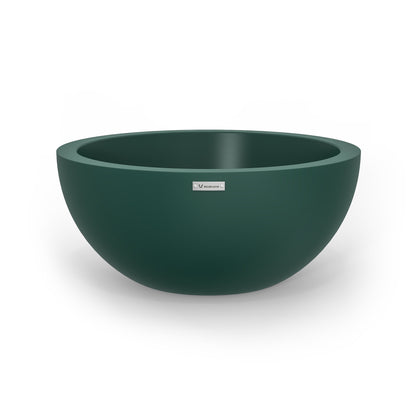 A large planter bowl in an emerald green colour made by Modscene.