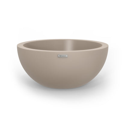 A large planter bowl in a sandstone colour made by Modscene.