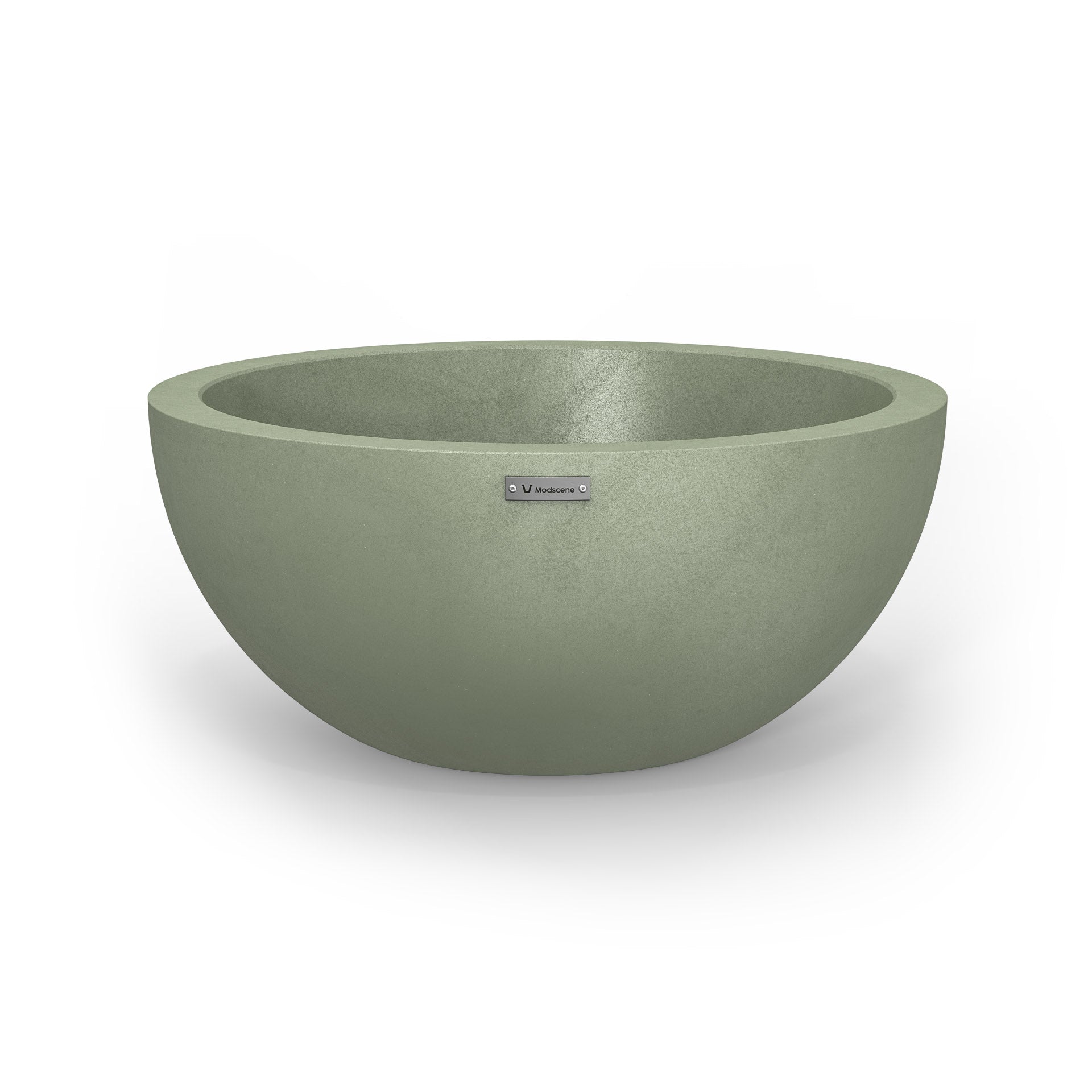 A large planter bowl in a pastel green colour with a concrete look finish.
