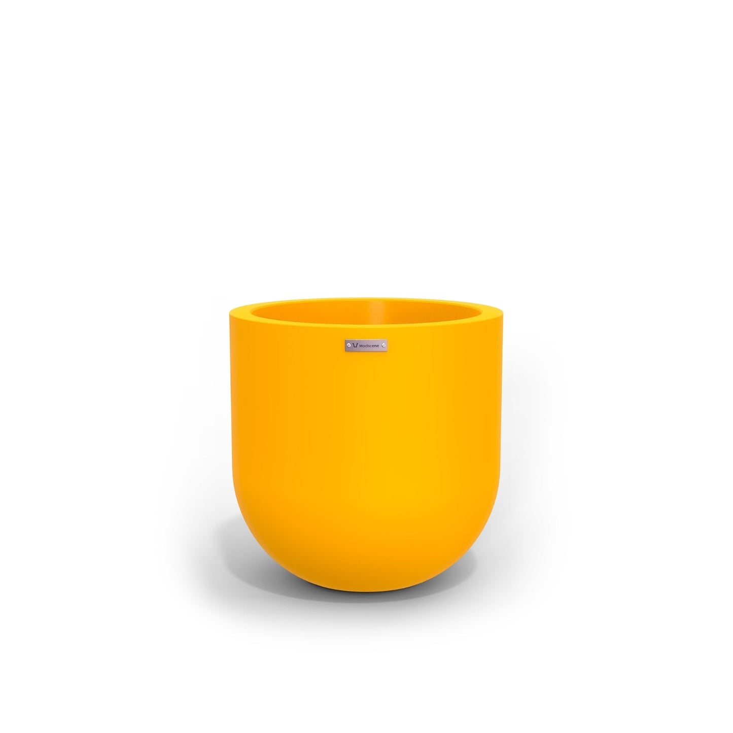 A large egg shaped pot by Modscene in yellow. NZ made planters.