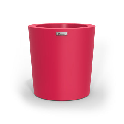 A modern designer planter pot in a rose pink colour. Australian planters.