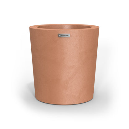 A modern designer planter pot in a rustic terracotta colour. 