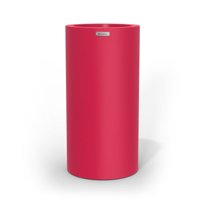 A tall cigar cylinder planter pot in pink made by Modscene. Australian planters.