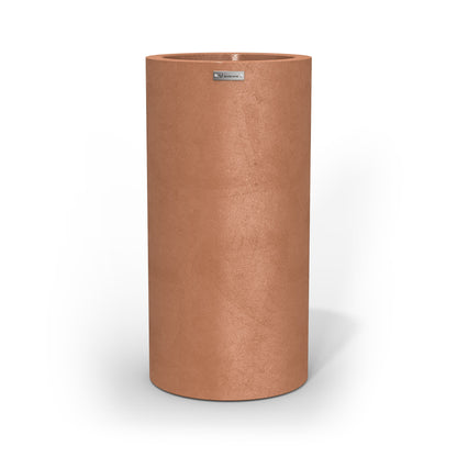 A tall cigar cylinder planter pot in a rustic terracotta colour made by Modscene.