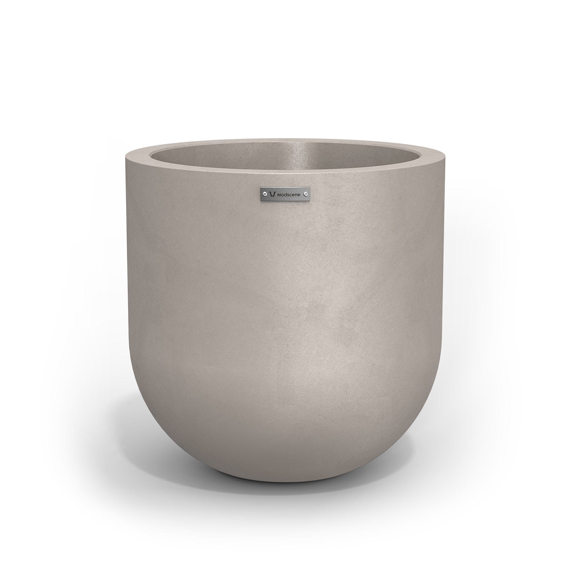 A medium sized planter pot in a sandstone colour with a concrete look finish.