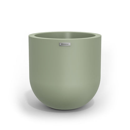 A medium sized planter pot in a pastel green colour made by Modscene.