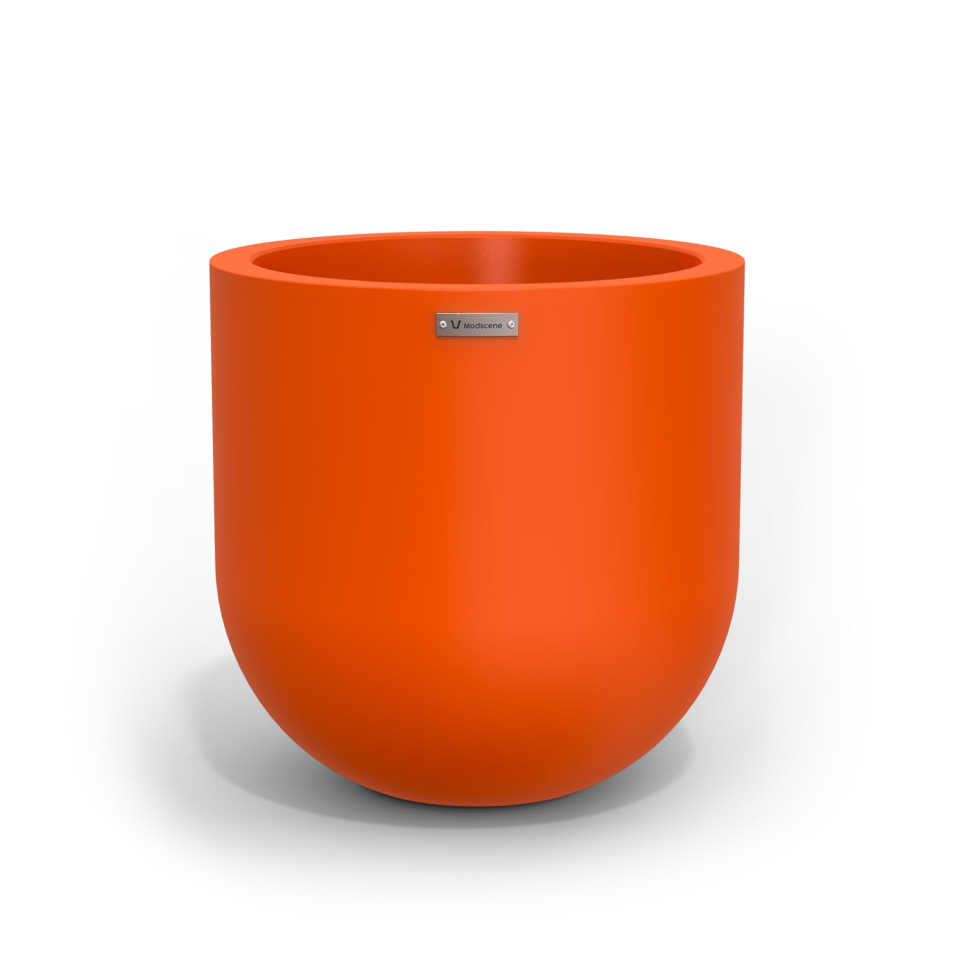 A medium sized orange planter pot made by Modscene.
