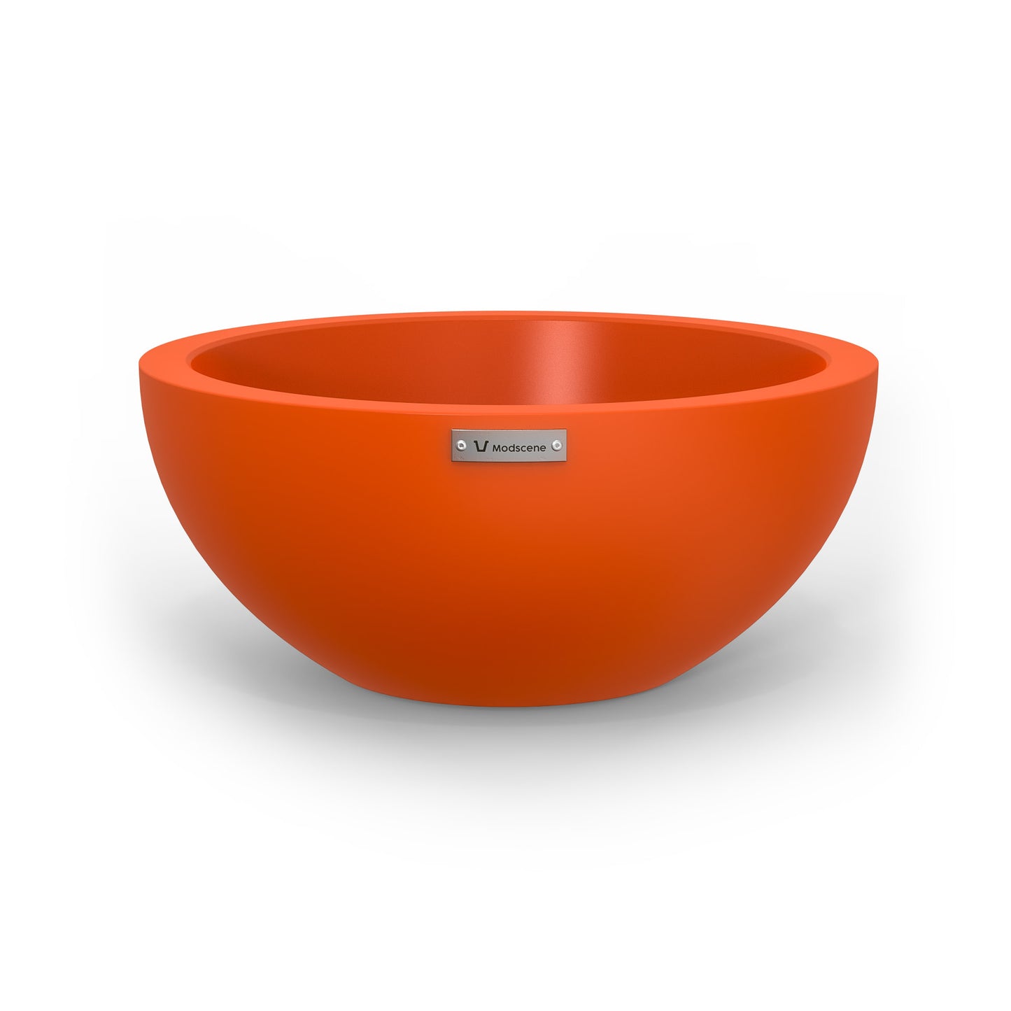 A small planter bowl in orange made by Modscene.