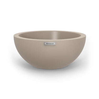 A small planter bowl in a sandstone grey colour made by Modscene.