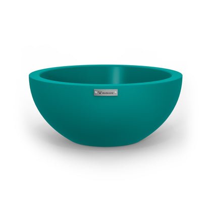 A small planter bowl in a teal blue colour made by Modscene. Australian planters.