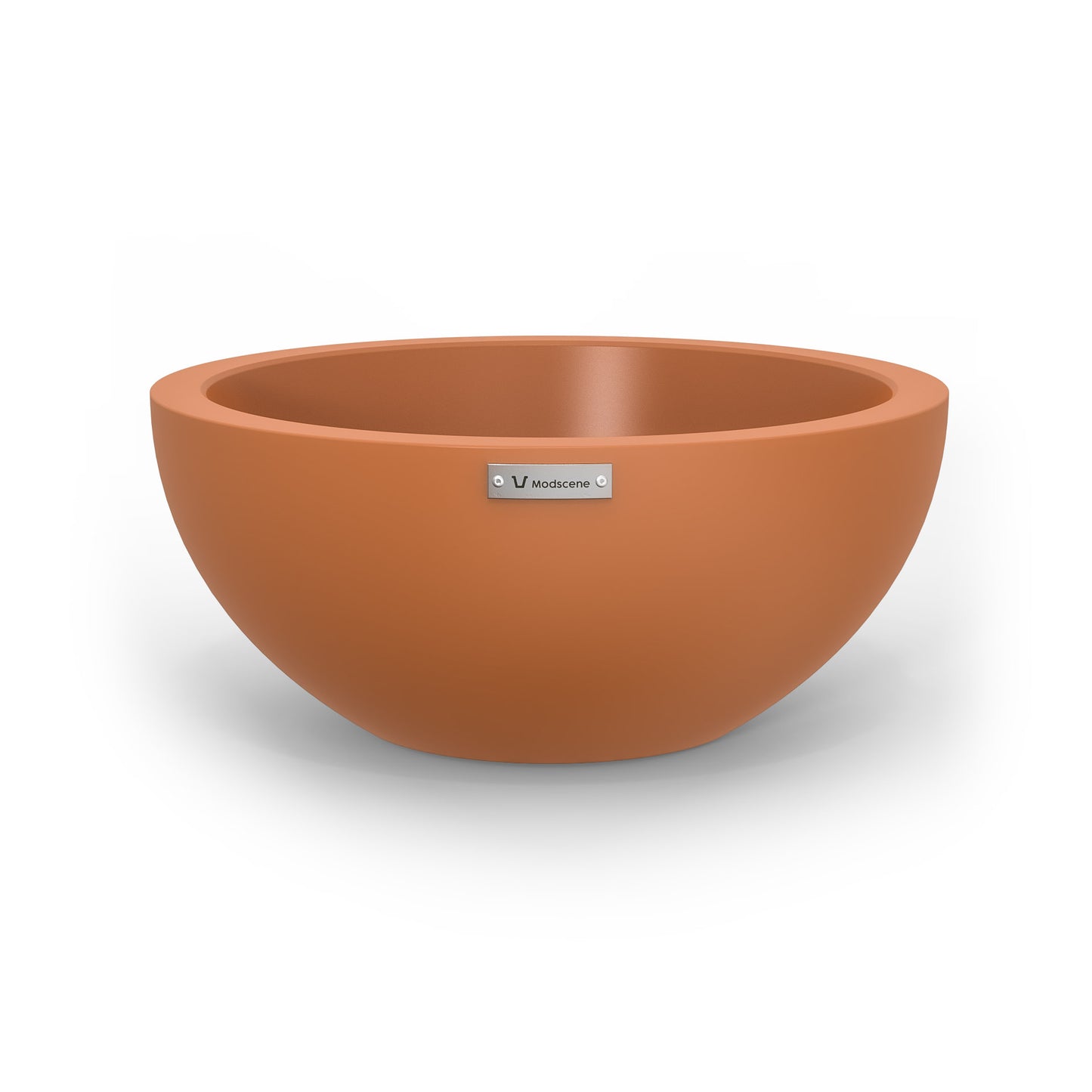 A small planter bowl in a terracotta colour made by Modscene.